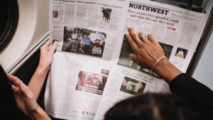 people reading a newspaper 10 Way to reduce stress naturally