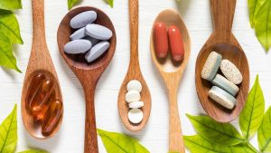 spoons full of different types of supplements 10 Way to reduce stress naturally